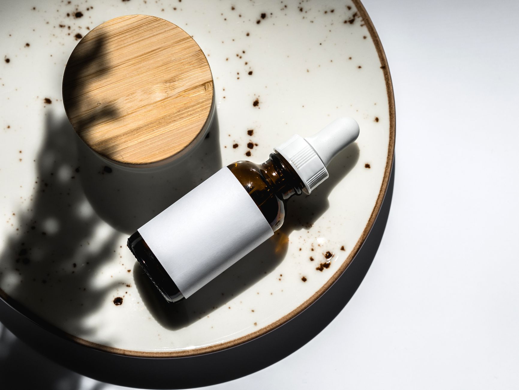 Bakuchiol and retinol serums side-by-side, illustrating a comparison for anti-aging skincare on a light background.