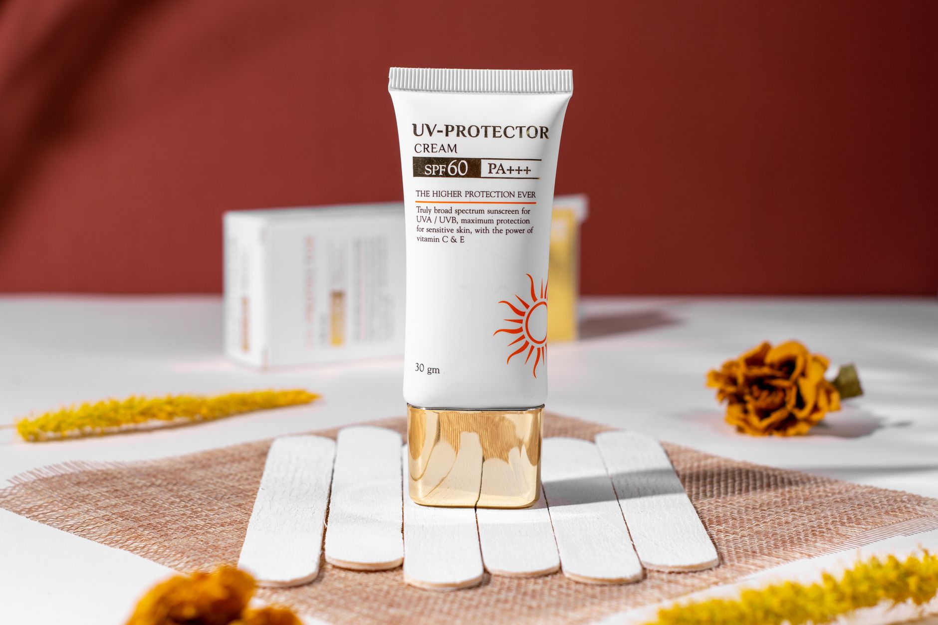 A selection of gentle sunscreens for sensitive skin displayed on a light, textured surface