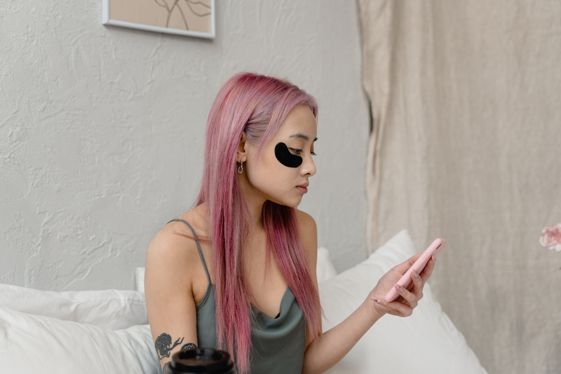 Close-up of a woman's eye area with under-eye patches applied